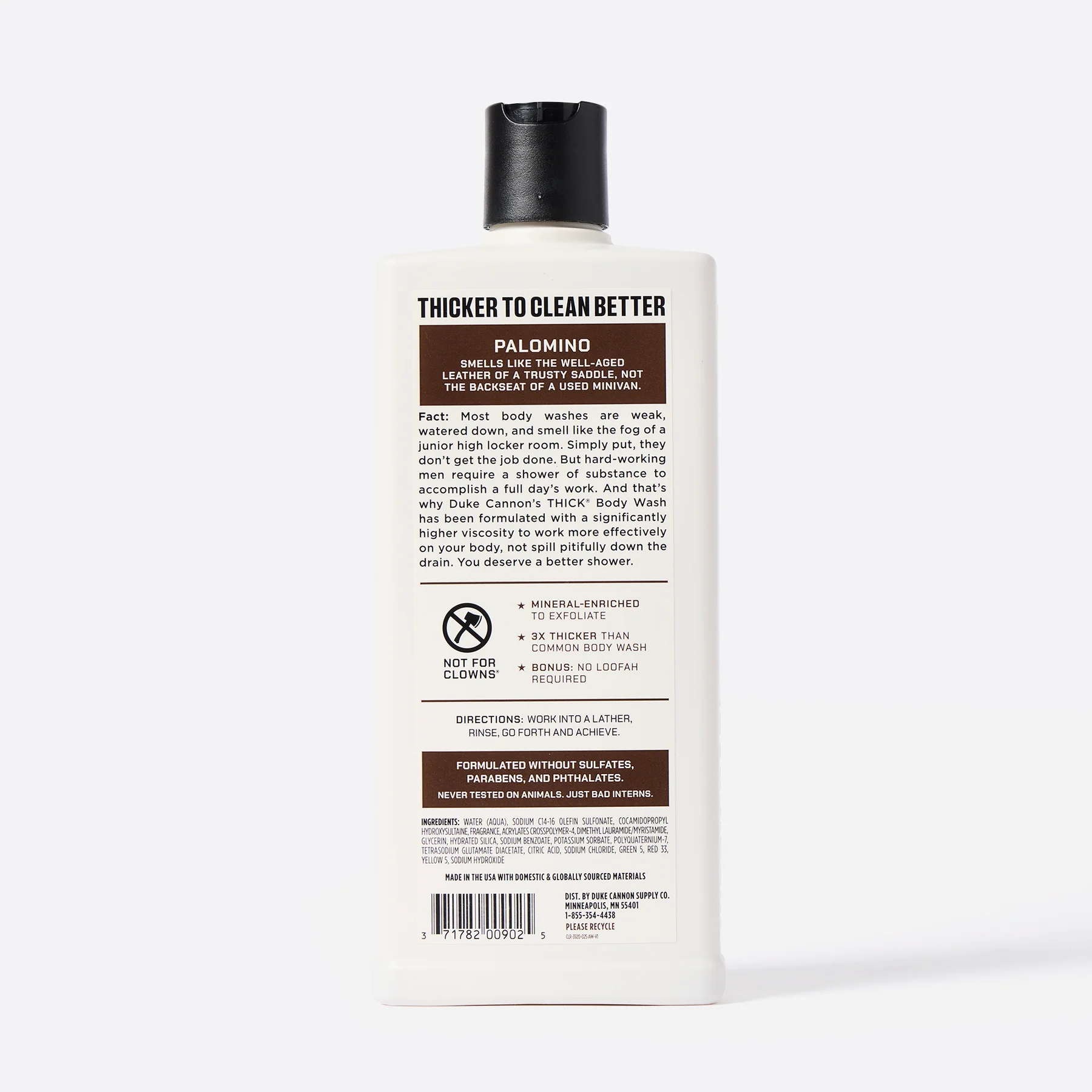 A white bottle of DUKE CANNON Palomino Thick Body Wash with a black flip-top cap, shown standing on a white background. Label: rich in minerals, three times thicker than other products, better cleansing, with a scent of mahogany and vanilla.